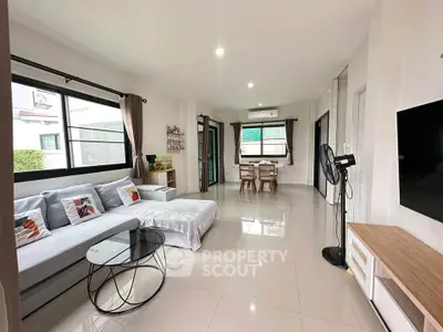Spacious modern living room with sleek furniture and natural light