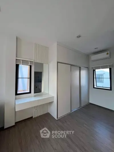 Spacious bedroom with built-in wardrobe and modern design
