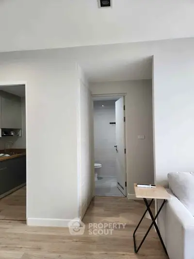 Modern apartment interior with open kitchen and cozy living area