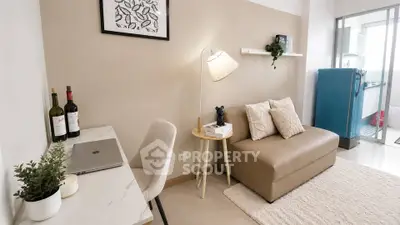 Chic living room with modern decor and cozy seating in a stylish apartment.