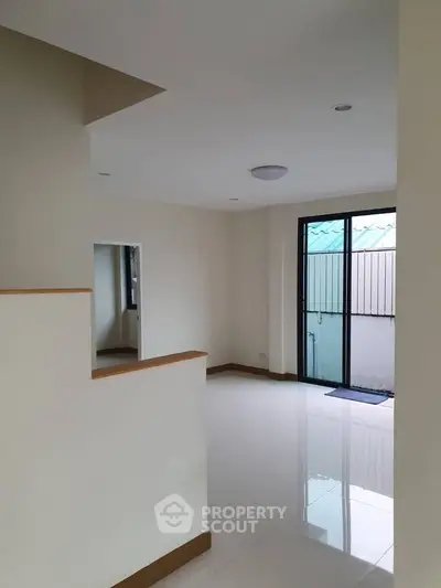 Spacious interior with modern design and large windows for natural light.