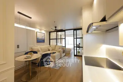 Modern open-plan living room with elegant decor and cozy seating area