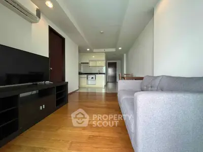 Spacious living room with modern kitchen in open layout apartment