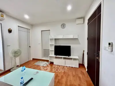 Modern living room with sleek furniture and wooden flooring