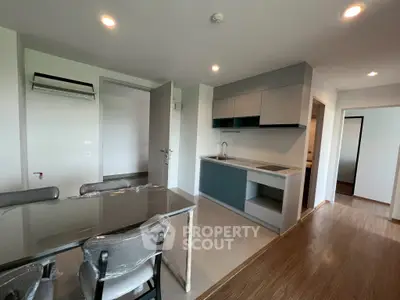 Modern kitchen and dining area with sleek cabinetry and contemporary design