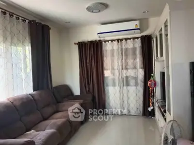 Cozy living room with plush sofas and modern air conditioning