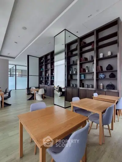 Modern library with sleek wooden tables and stylish shelving in a contemporary building