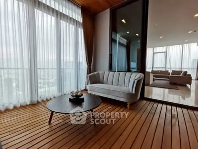 Luxurious balcony with elegant seating and panoramic city view