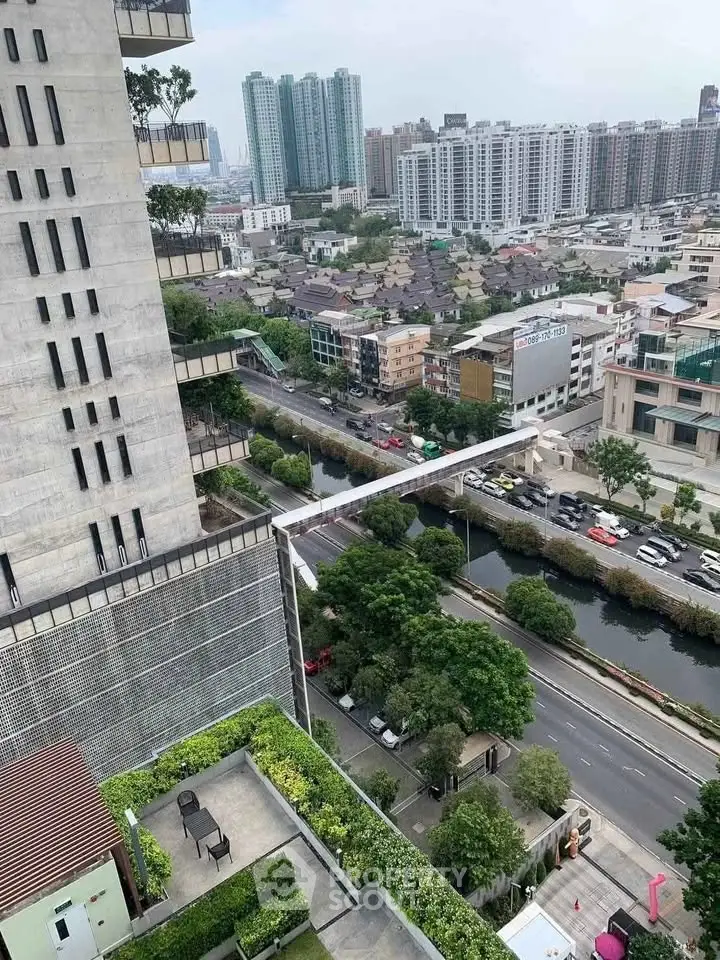 Stunning urban view from high-rise building with lush greenery and cityscape