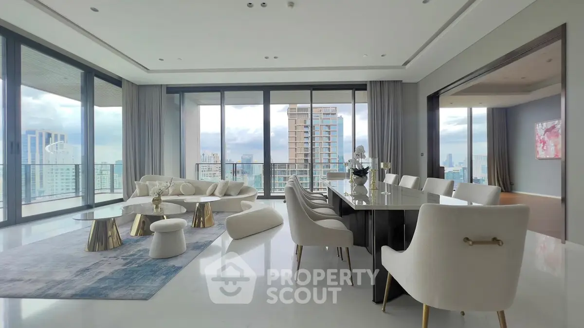 Luxurious modern living room with panoramic city views and elegant furnishings.