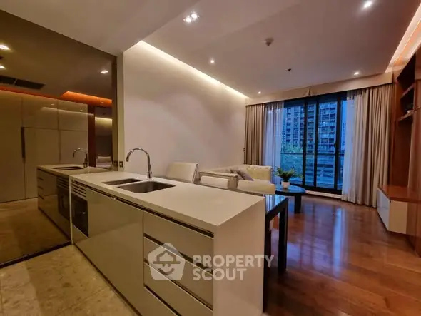 Modern living room with sleek design and city view from large windows.