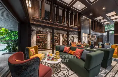 Luxurious living room with elegant decor and vibrant seating, showcasing a sophisticated interior design.