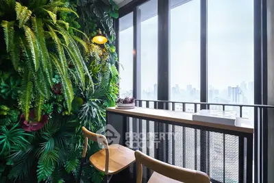 Stylish balcony with lush vertical garden and city skyline view, perfect for relaxation and urban living.