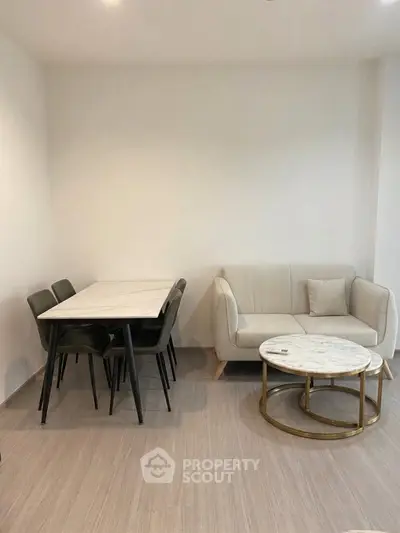 Modern minimalist living room with sleek furniture and neutral tones, perfect for stylish urban living.