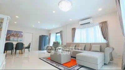 Spacious modern living room with elegant decor and ample natural light