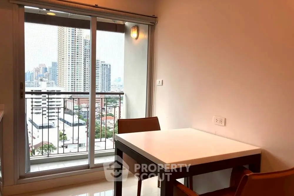 Modern apartment dining area with city view balcony
