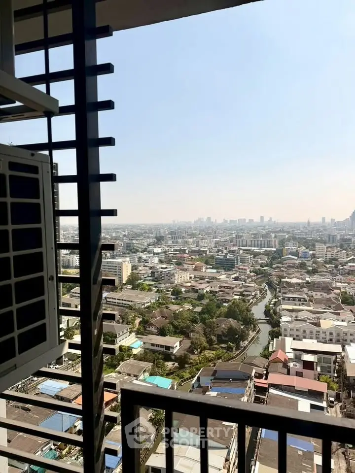 Stunning high-rise city view from a balcony, showcasing urban landscape and skyline.