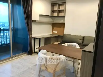 Modern living room with balcony view and stylish furniture in a contemporary apartment.