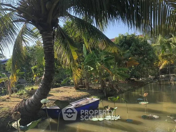 Tropical garden oasis with serene pond and lush greenery