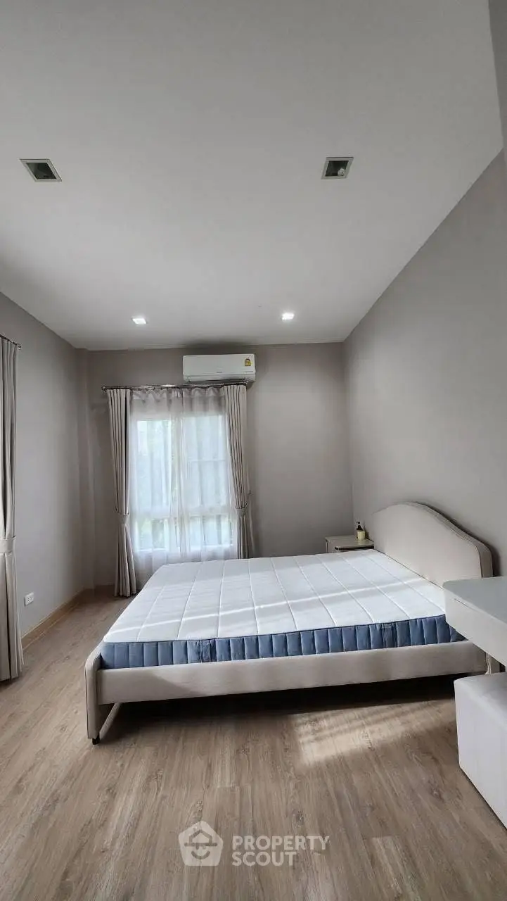 Spacious bedroom with modern design and natural light