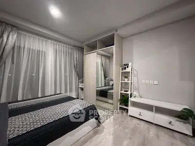 Modern bedroom with stylish decor and ample storage space