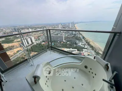 Luxurious balcony with jacuzzi offering stunning ocean and city views