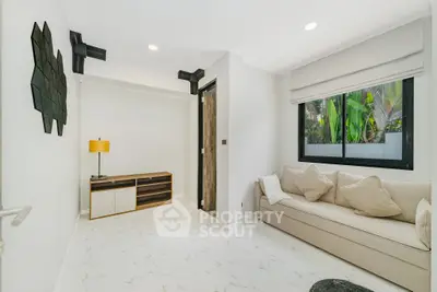 Modern living room with elegant decor and large window view