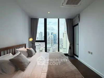 Luxurious bedroom with stunning city view in modern high-rise apartment