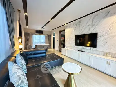 Luxurious modern living room with elegant marble accents and sleek black leather sofa.