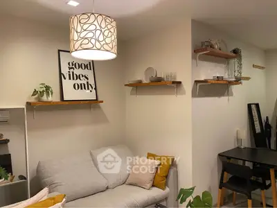Cozy living room with modern decor and stylish lighting, perfect for relaxation and entertaining.