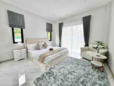 Luxurious bedroom with elegant decor and natural light