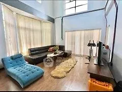 Spacious modern living room with high ceilings and stylish furniture