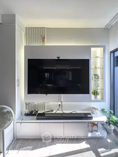 Modern living room with sleek TV setup and stylish decor