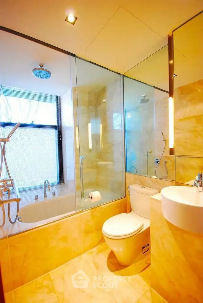 Luxurious modern bathroom with glass shower and elegant fixtures