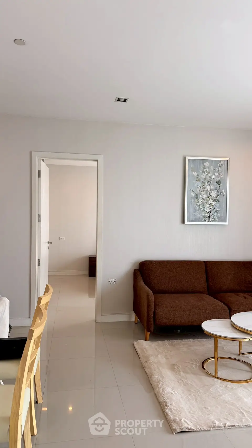 Modern living room with elegant brown sofa and stylish decor