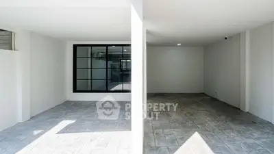 Spacious modern garage with clean lines and ample natural light