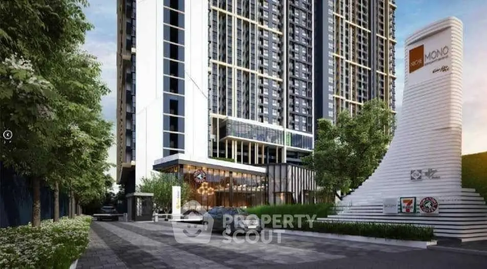 Modern high-rise building exterior with lush landscaping and sleek entrance.