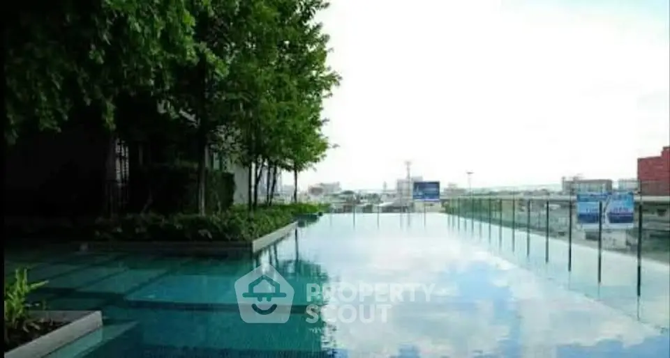 Luxurious rooftop infinity pool with stunning city views and lush greenery.