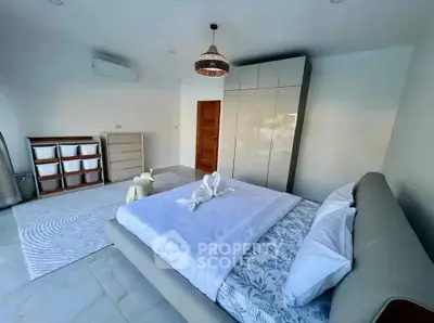Modern bedroom with stylish decor and ample storage space