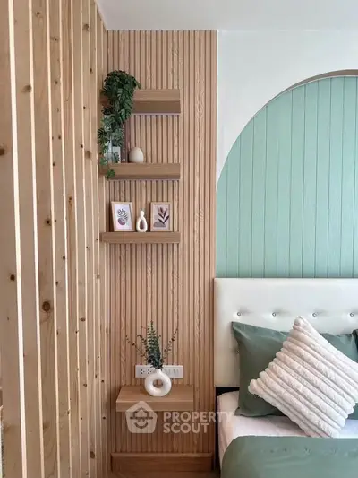 Stylish bedroom with modern decor and wooden accents, featuring a cozy bed and decorative shelves.