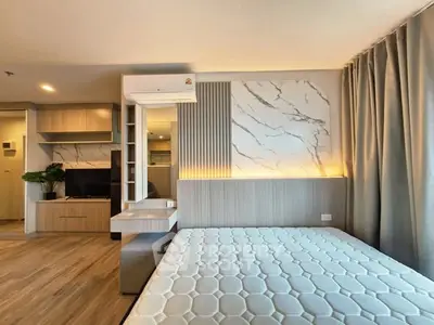 Modern bedroom with stylish decor and natural light