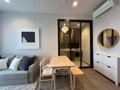 Modern living room with stylish furniture and elegant decor in a cozy apartment setting.