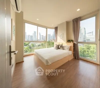 Luxurious bedroom with panoramic city view and modern decor