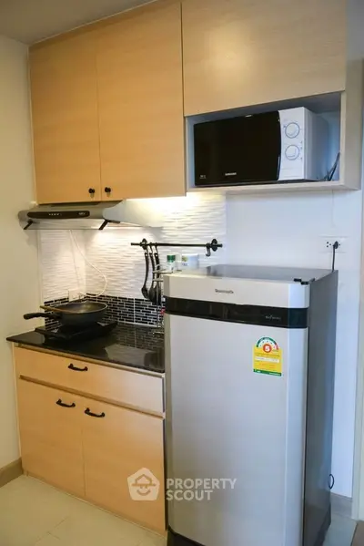 Modern kitchen with sleek appliances and stylish cabinetry