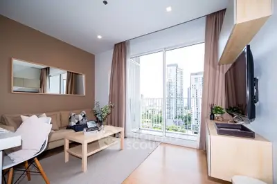 Modern living room with large window and city view, featuring cozy seating and stylish decor.