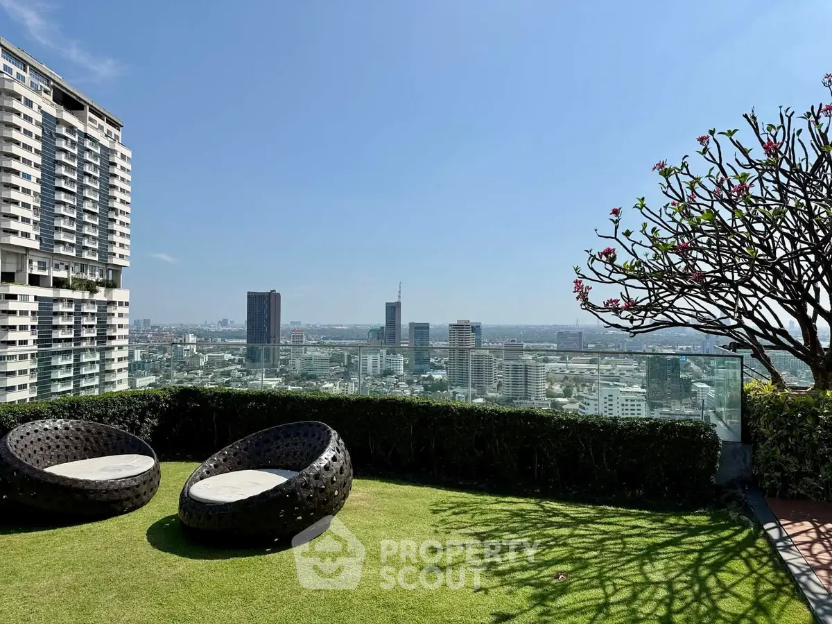 Stunning rooftop garden with panoramic city views and modern seating area.