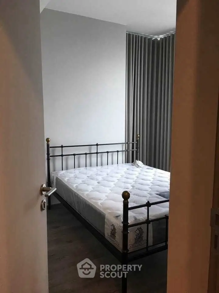 Modern bedroom with metal bed frame and minimalist design