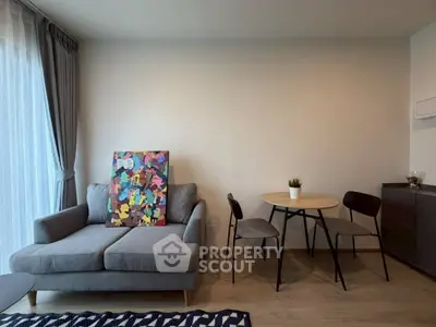 Modern living room with stylish decor and cozy seating area.