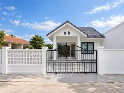 Charming single-story home with modern design and gated entrance, perfect for family living.