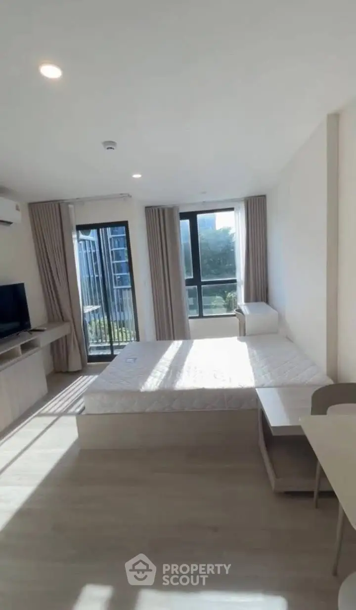 Bright modern bedroom with large windows and minimalist decor